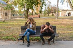 Disappointed couple arguing about money