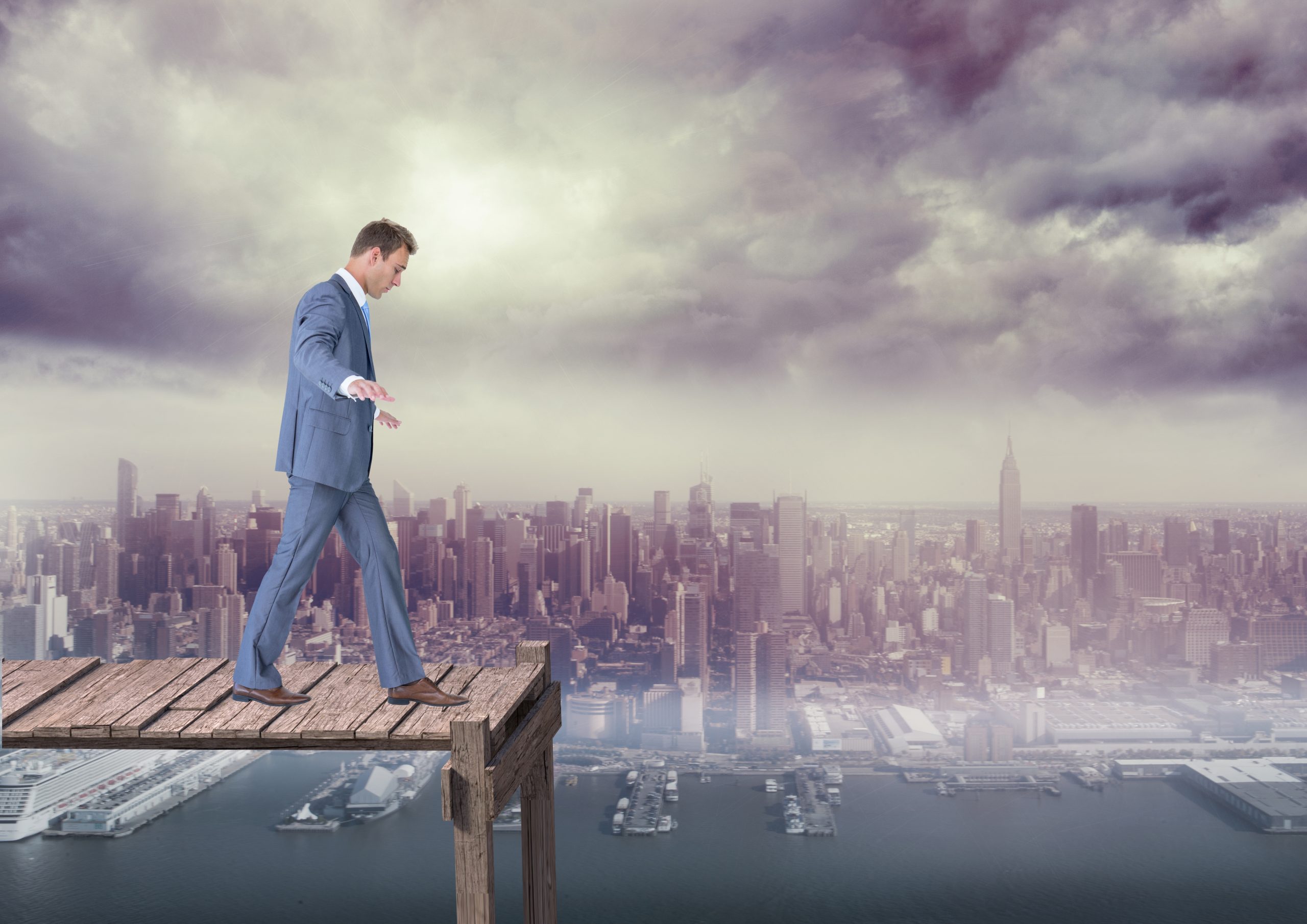 usinessman walking over a wooden bridge with cityscape in the background